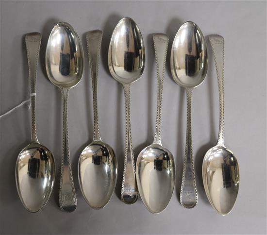 Seven assorted George III bright cut tablespoons, 11.5 oz.